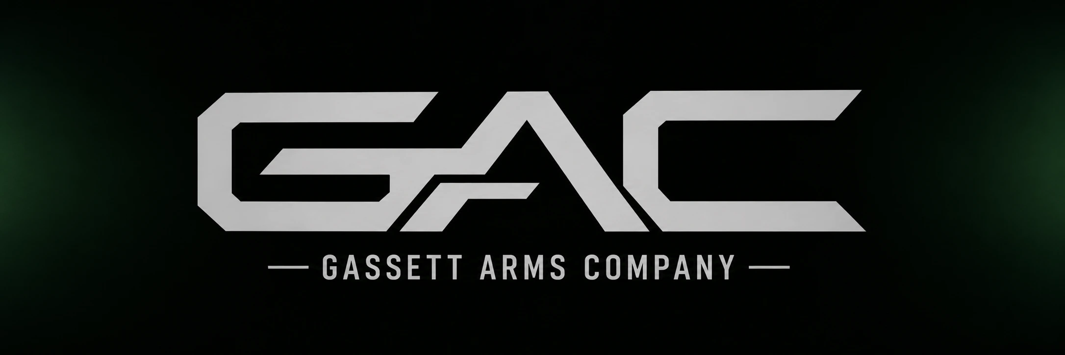 Gassett Arms Company — silver GAC emblem on a dark tactical background